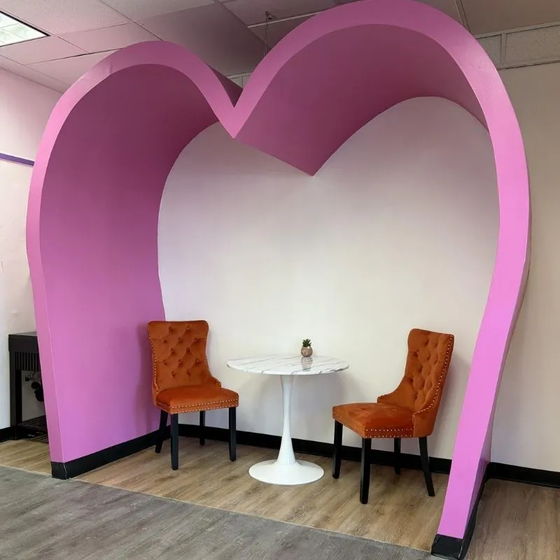 Pink heart-shaped photo booth nook inside the dessert shop at Crunchy Sweet, a Ice Cream Shop in Portland
