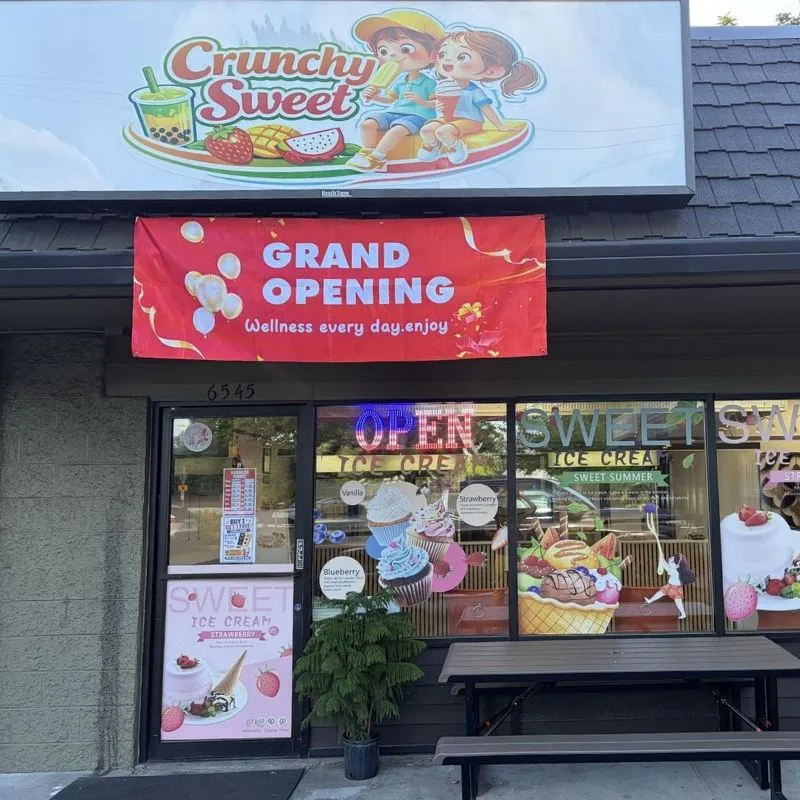 Storefront with grand opening banner and shop signage at Crunchy Sweet, a Ice Cream Shop in Portland